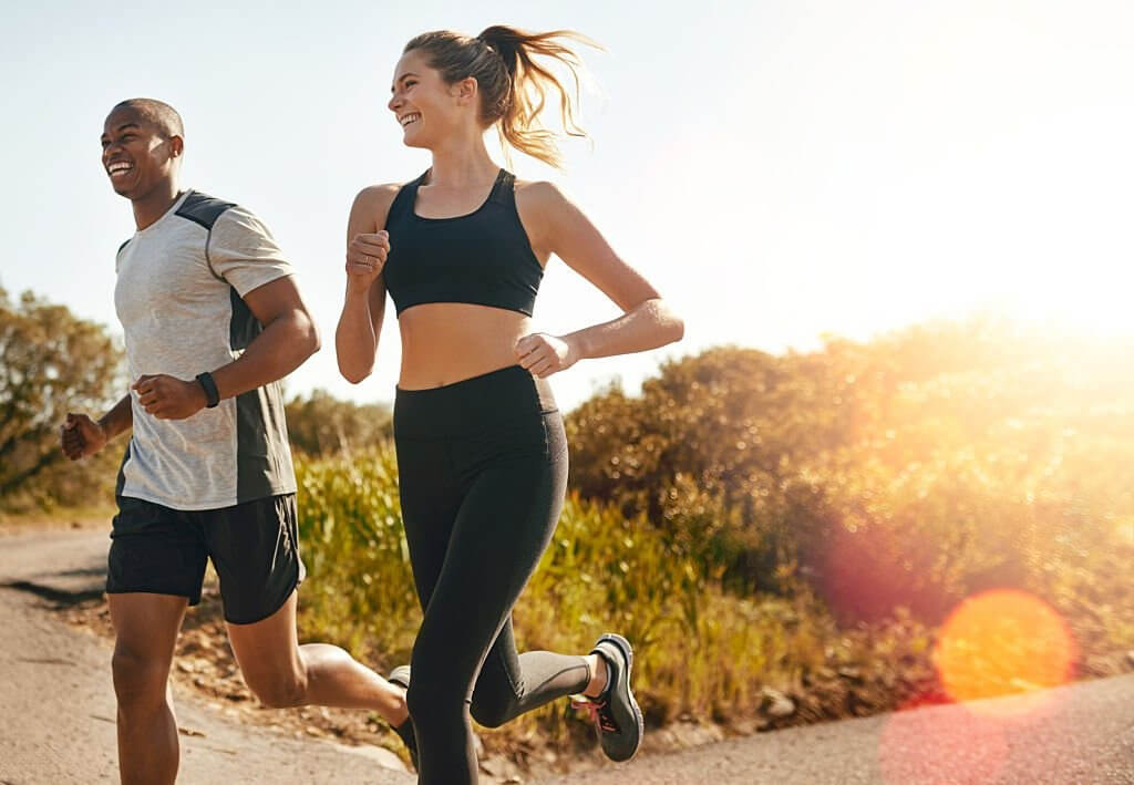 happy and health people running outdoors, enjoying an active lifestyle